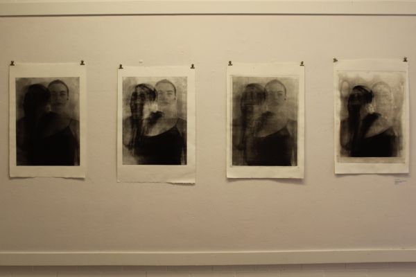 Four photo prints on a white wall