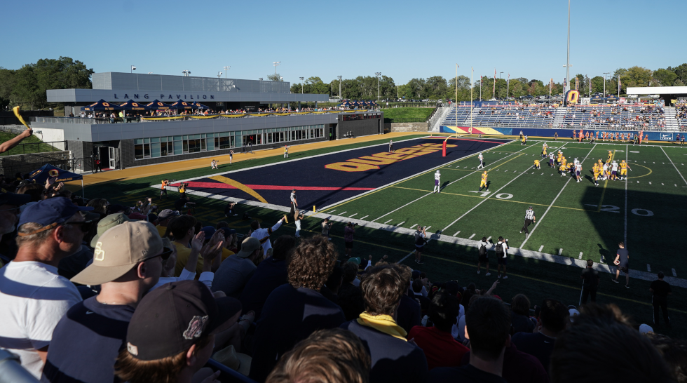 a view of Richardson Stadium from the stands during a football game. The Lang Pavilion is visible to the left.