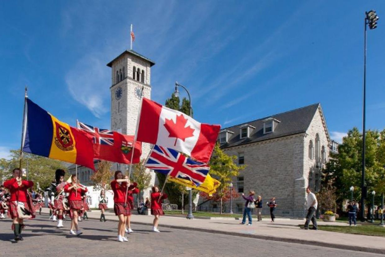 Queen's bands marching in front of Grant Hall