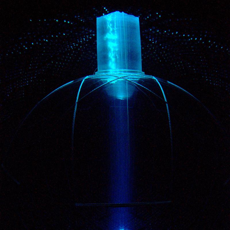 The detector, illuminated by light from the clean room at the top of the vessel neck, producing a beam effect.