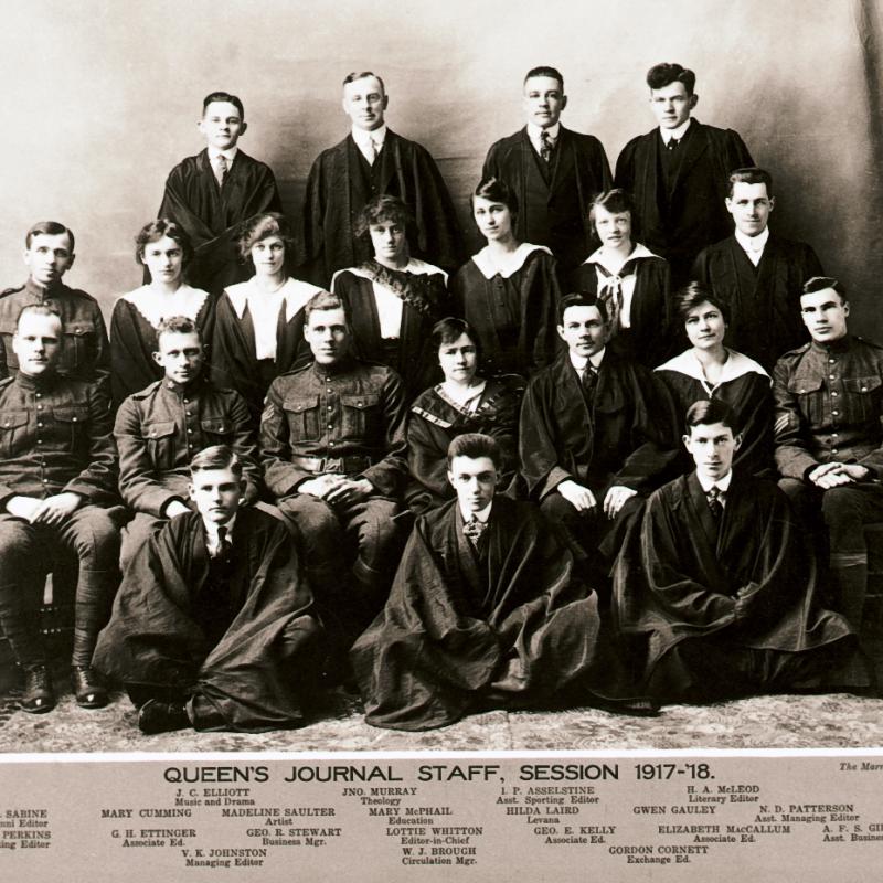 Queen's Journal staff in 1918. Men and women posed in four rows looking at the camera.