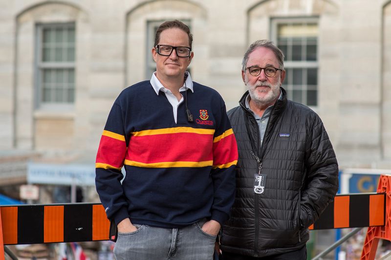 Ari Magder (ArtSci’98), left, and Dennis Chapman (ArtSci’75), like many Queen's alumni, were ready and willing to help out current Film and Media students during the recent Locke & Key shoot in downtown Kingston. Chapman is the production manager and Magder is the first assistant camera for the Netflix production. (Courtesy Kingston Film Office)