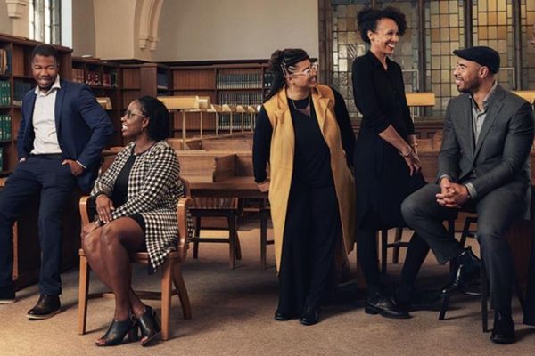 Black Studies professors pose in a library