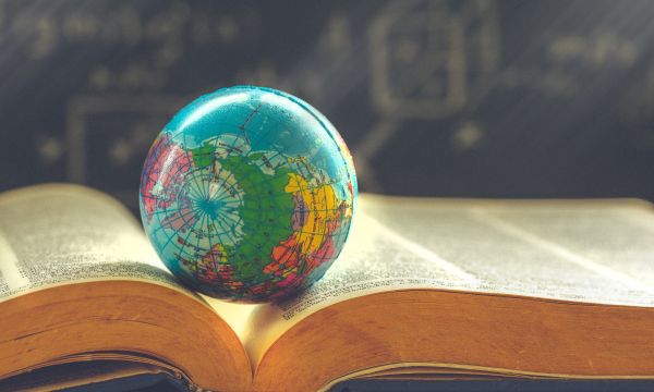 World globe on book