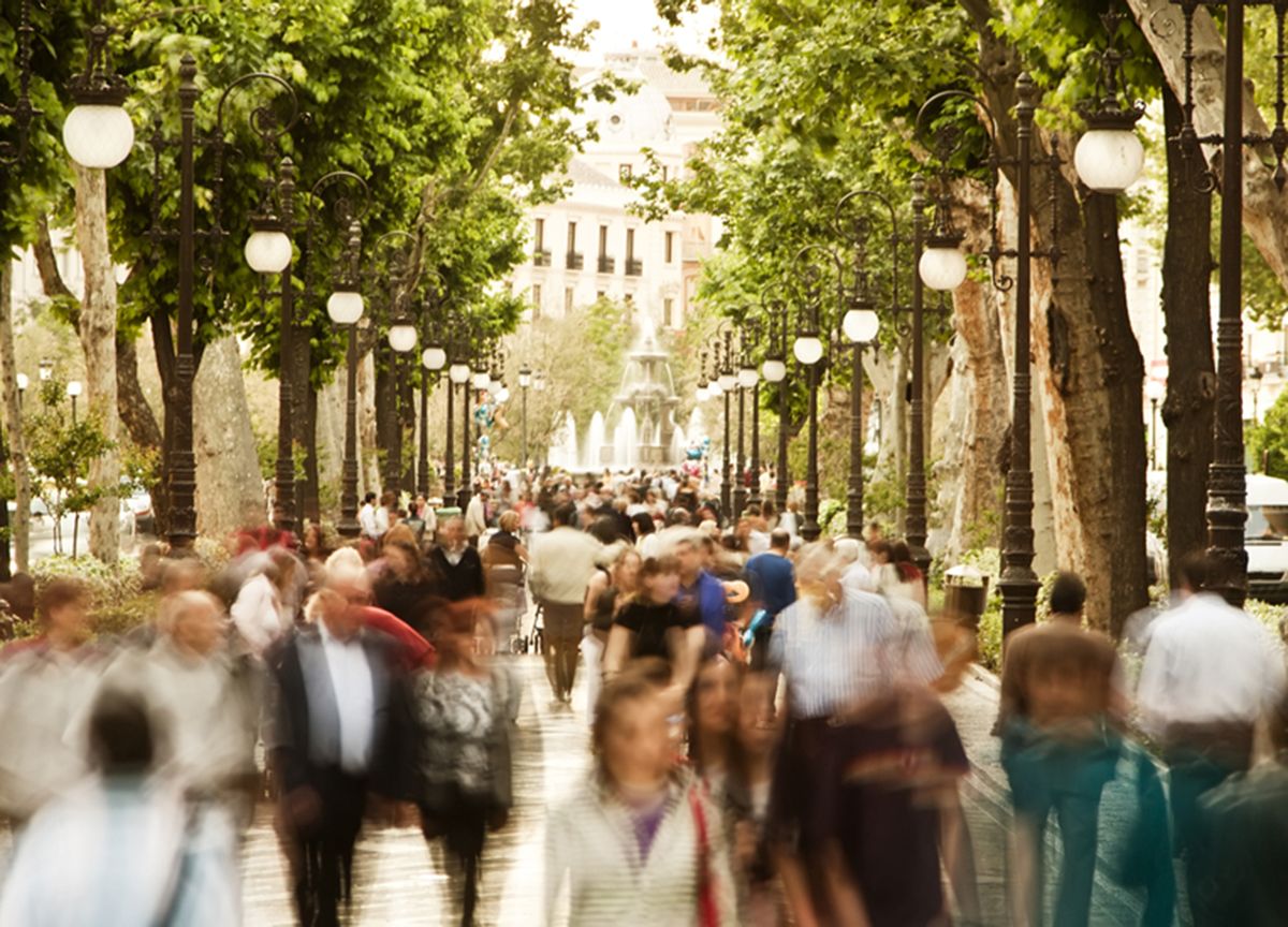 People walking down a walkway blurred out