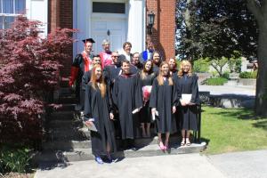 Graduates outside a building on its steps