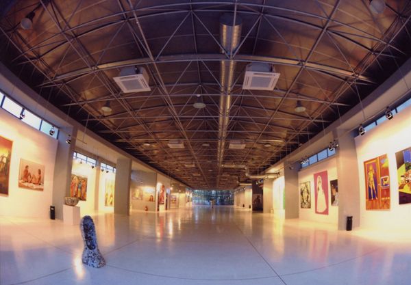 A large room with walls filled with art