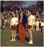 [Alfie in  football game costume with female cheerleaders, late 1940s]