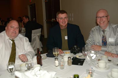 Eighties grads Mike Showers, Doug Knutson and John Esford after dinner.