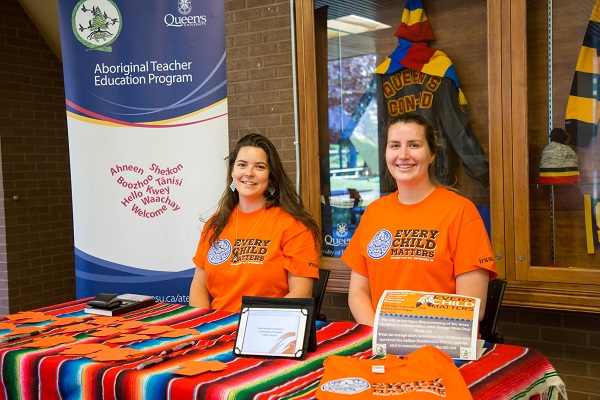 Two students staff the Orange Shirt Day booth in Duncan McArthur Hall. (Supplied Photo)