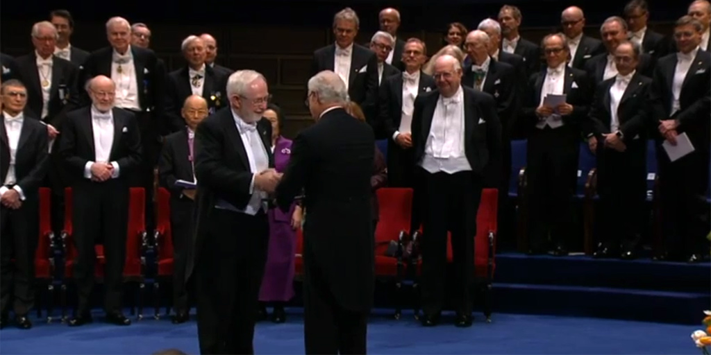 [Art McDonald on stage receiving Nobel Prize fro the King of Sweden]