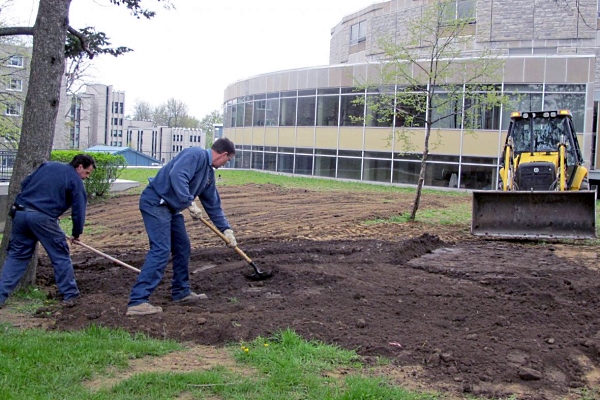 [Physical Plant Services work on improving grounds]