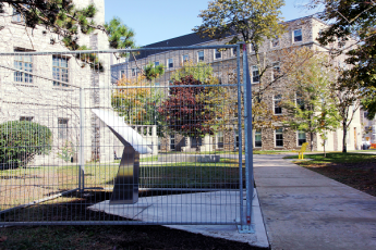 The first Queen's Remembers plinth, dedicated to the Anishinaabe and the Haudenosaunee peoples upon whose traditional lands Queen’s was built, will be unveiled on McGibbon Walk on October 16. (University Communications)