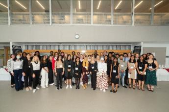 Photograph of students in Queen's access and inclusion programs at a reception.