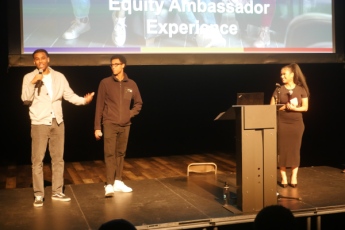 Photograph of Peer Equity Ambassadors speaking at an outreach in Regent Park