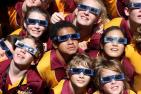 Children wearing special glasses designed to view an eclipse.