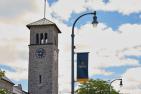 A blue pole banner in front of Grant Hall tower.