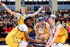 Four Gaels basketball players lift the Wilson Cup