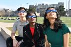 Students watching the sun with eclipse glasses