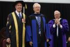 [Donald Sobey accepts honorary degree with Jim Leech and David Saunders]