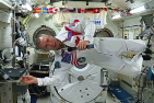 [Dr. Feustel broadcasts in International Space Station (Photo: Queen's/Facebook Live)]