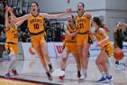Members of the Queen's Gaels womens basketball team celebrate after beating the Waterloo Warriors.