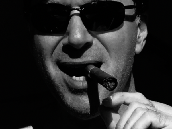 Black and white image of Douglas with a cigar