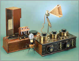 The soprano Nellie Melba used this microphone in her first concert from Marconi's hut near Chelmsford, UK. At left is a 1907 shipboard mggnetic detector. Also shown are a Fleming valve and a multiple tuner.