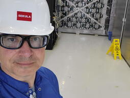 Dr. Sekula posing in front of the HALO detector