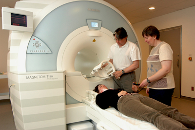 Photo of a person being positioned in an MRI system