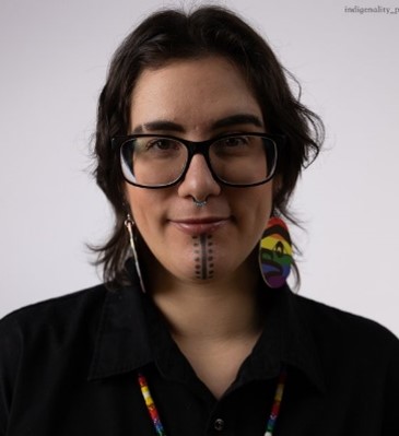 Headshot of Gabe wearing a black shirt.