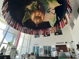 Flags of the world hanging in a room