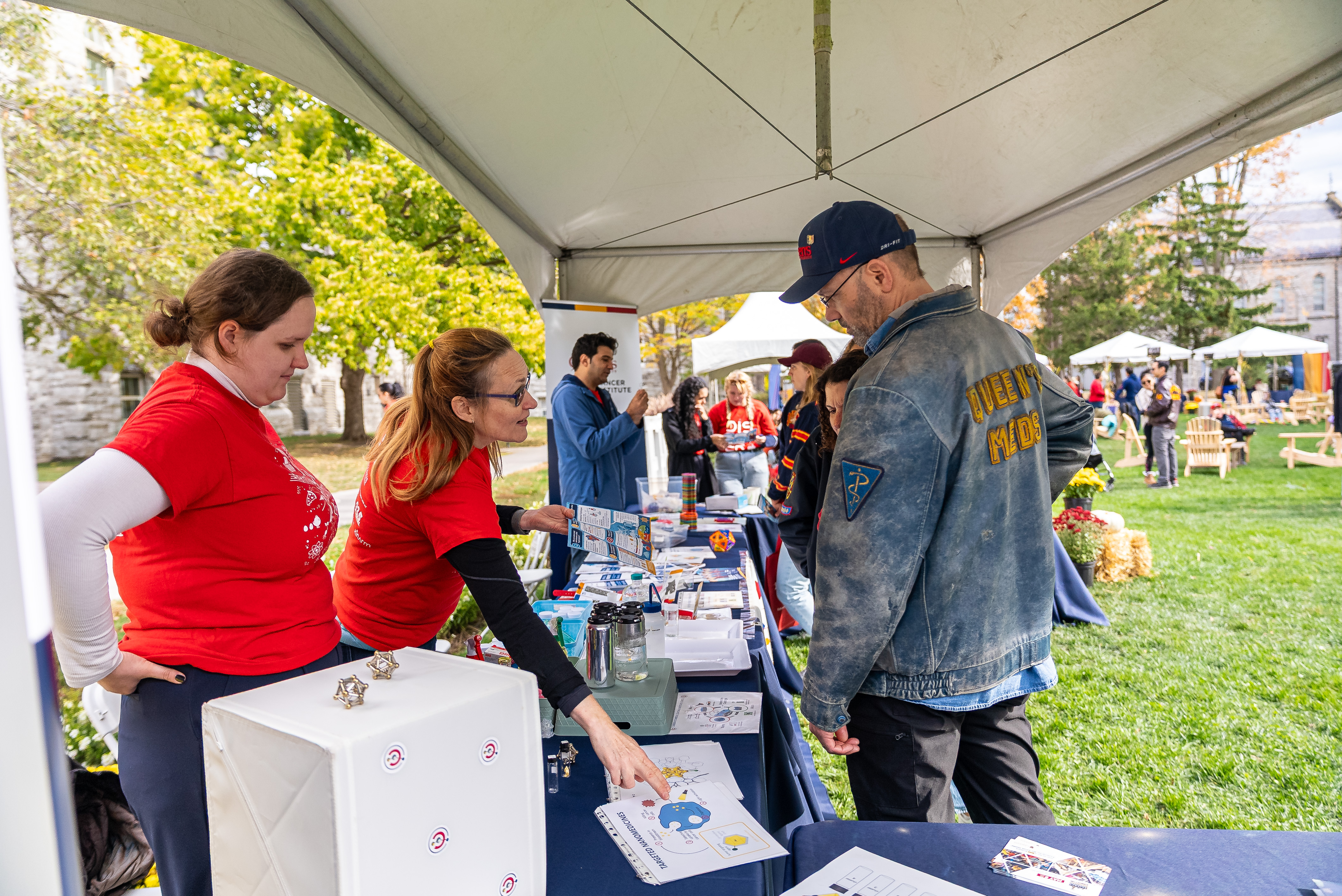 Alumni explore a campus display at last year’s Fall Harvest Alumni Gathering.