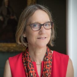 Dr. Alison Noble, Technikos Professor of Biomedical Engineering, wearing a red blouse and animal print scarf. 