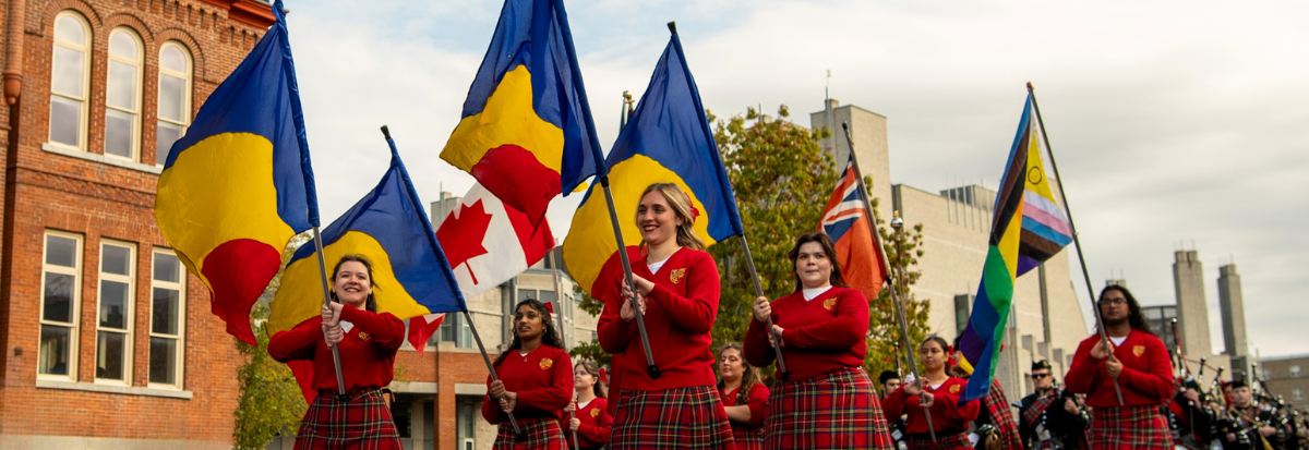 Street view of the Homecoming Parade in 2025 at Queen's University.