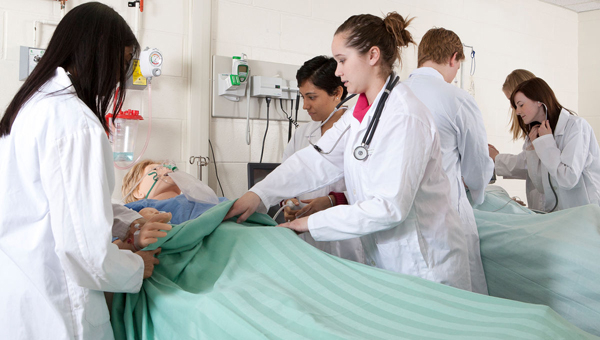 Second and fourth-year nursing students in a patient simulation lab