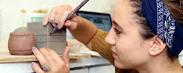 Student with pottery