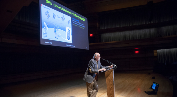 Dr. Barry Barish speaks at a podium