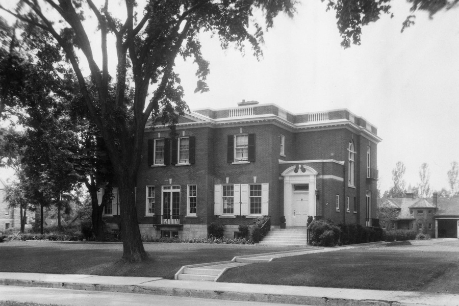 Black and white photo of Agnes Etherington's large brick home, 1930s-40s, before its transformation into an art gallery.