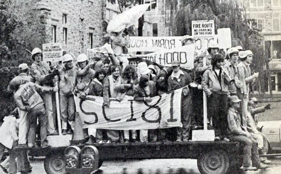 Scene of Homecoming 1978, showing the class of Sci'81 celebrating on a vehicle.