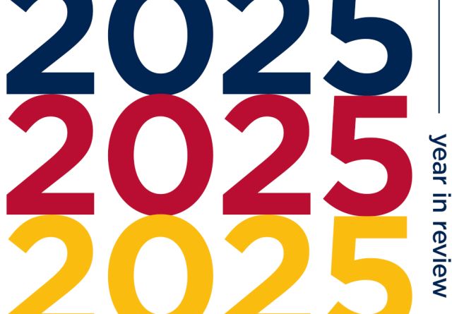 A graphic displaying the year 2025 three times in vertical alignment - one blue, one red, one yellow - with the words "year in review" displayed in smaller text on the side.