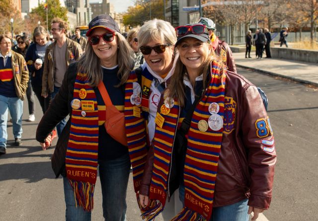 Alumni share a laugh during last year’s Alumni Parade to Richardson Stadium.