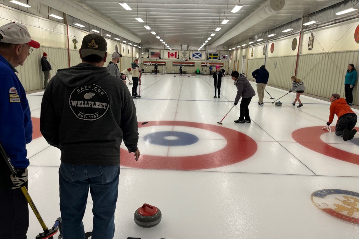 Alumni playing a game of curling.