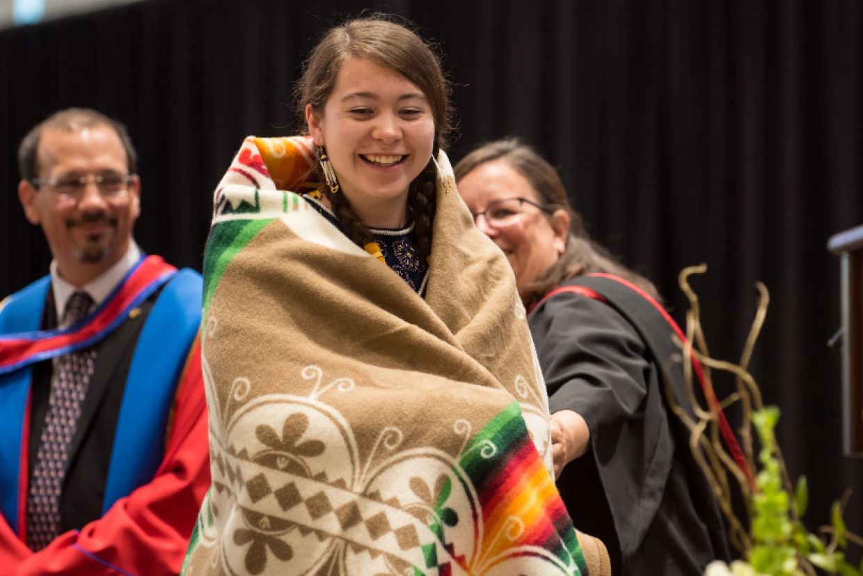 Spring Convocation blanket ceremony with Billie Kearns, Sc'19. Photo credit: Garrett Elliott