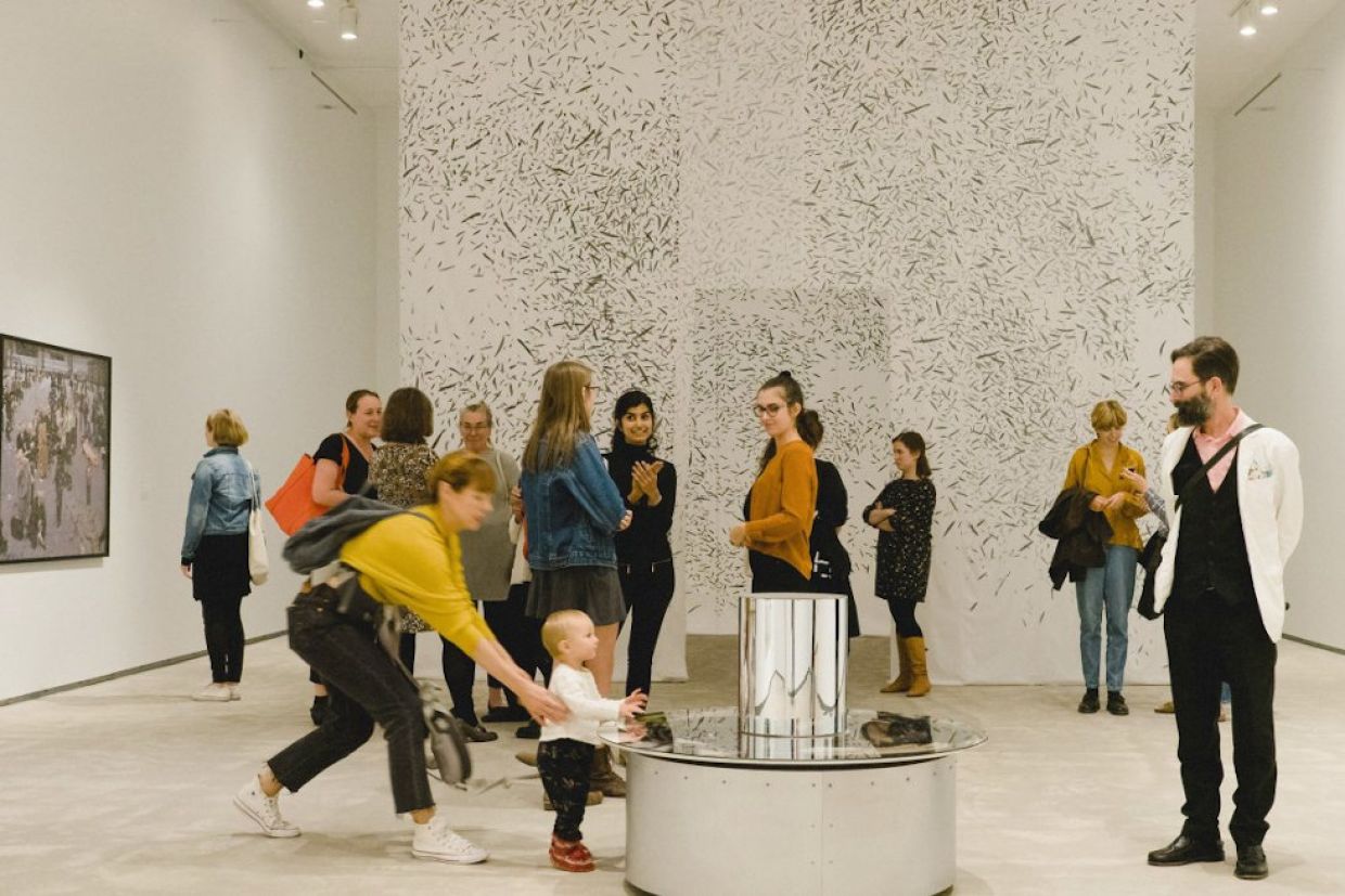 Visitors enjoy The hold: movements in the contemporary collection.