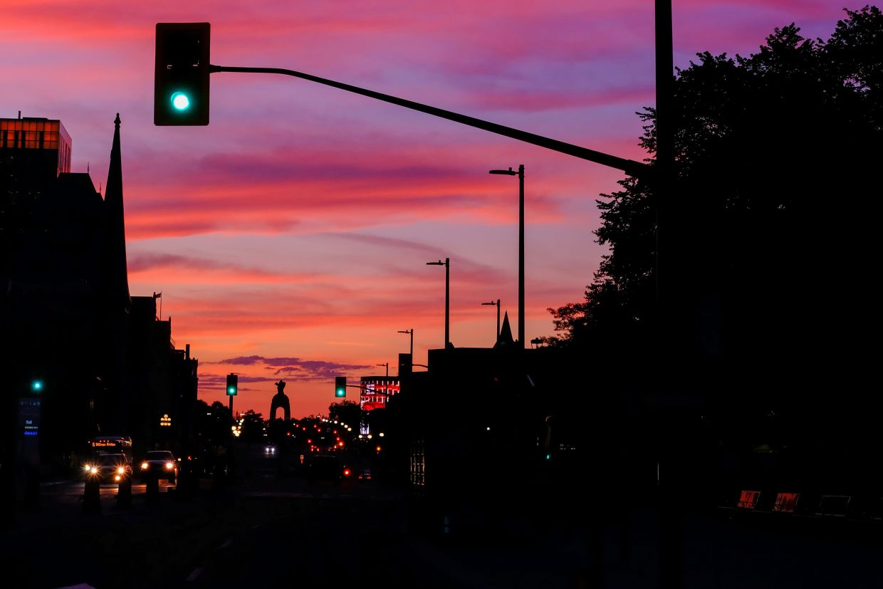 A view down Elgin Street towards the War Memorial at sunset