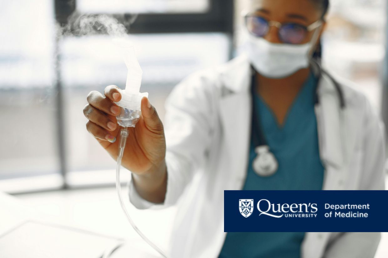 A woman wearing glasses and a white coat holds an oxygen tank, representing a new era in cystic fibrosis care.
