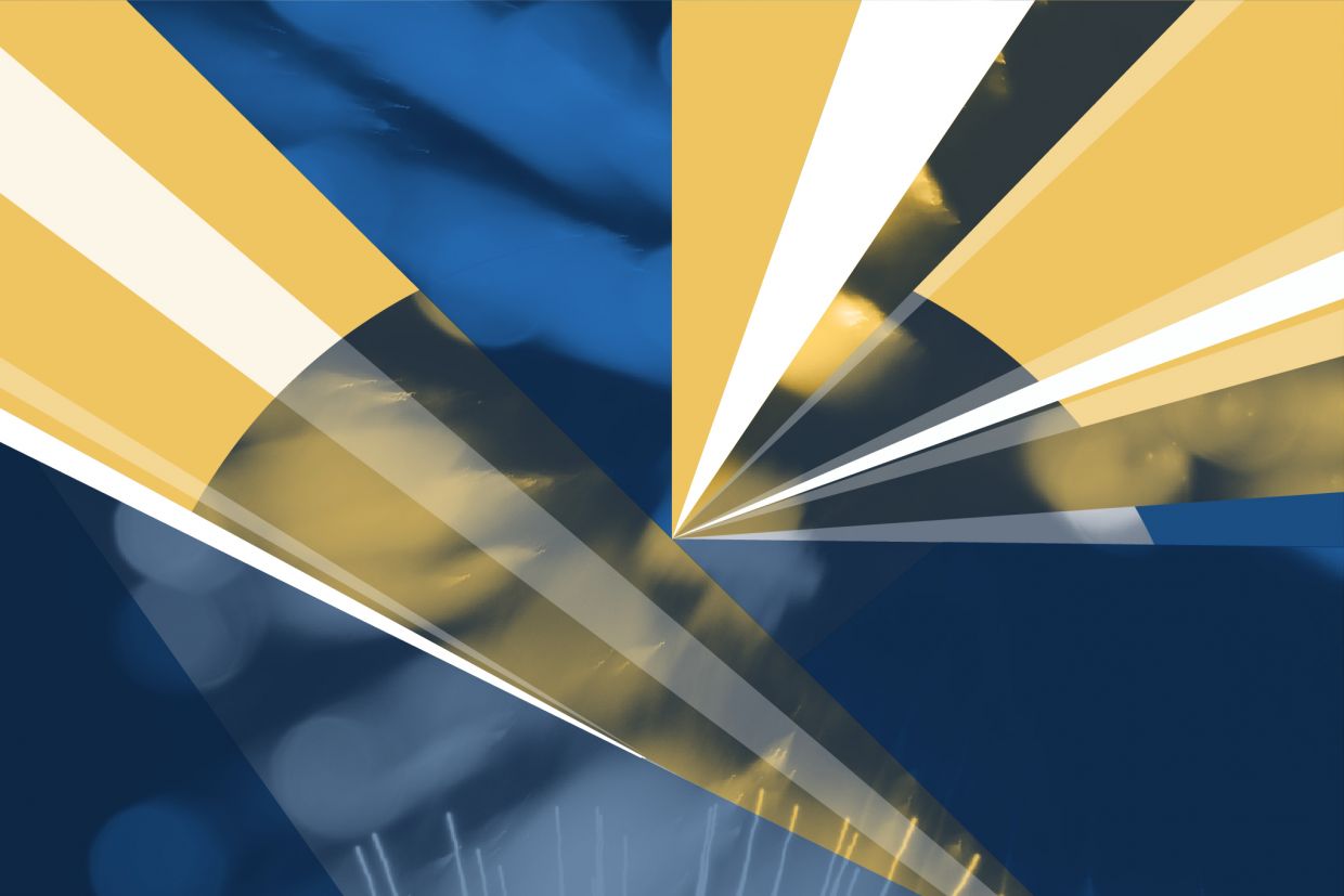 Yellow spotlights on a blue background