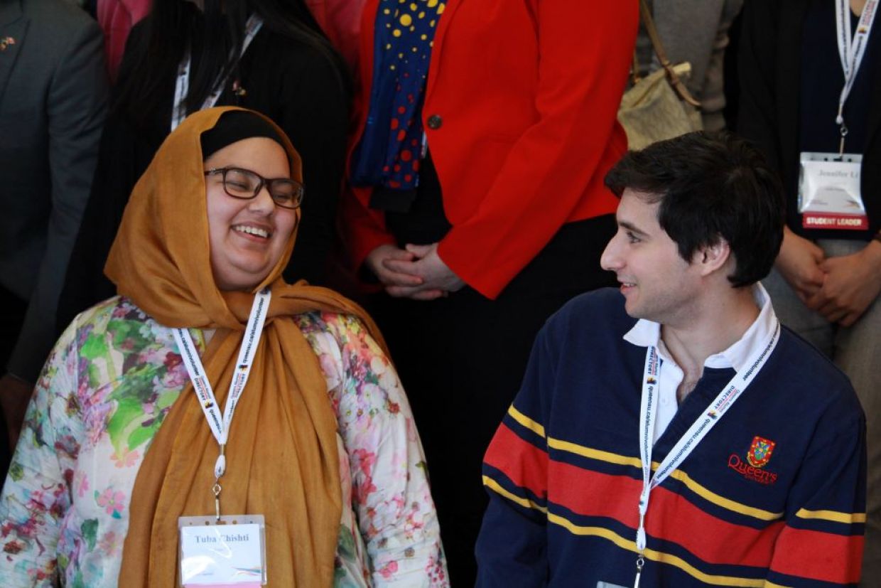 two Alumni Volunteer Summit Attendees talking at 2017 event 