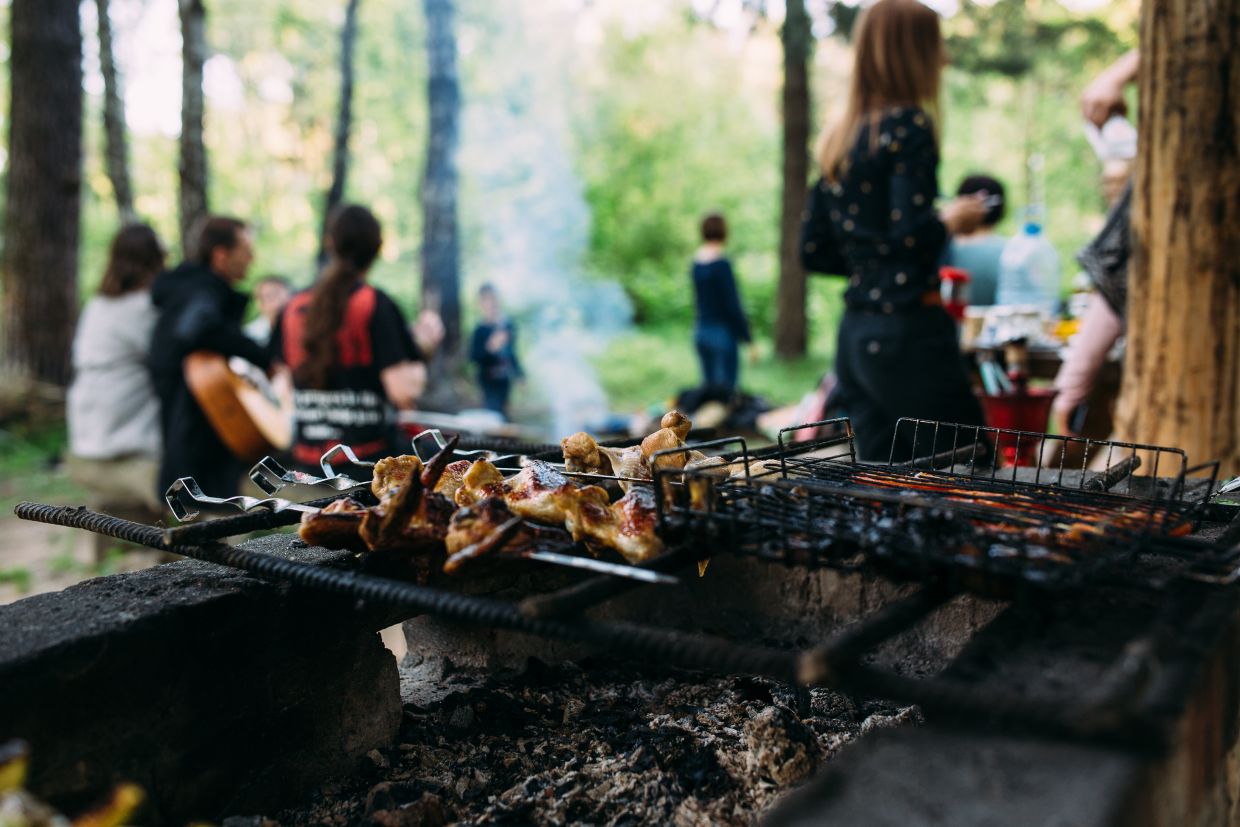 A group of people at an outdoors bbq